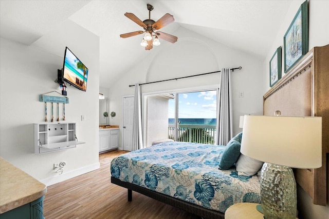 926 Whelk Ct Unit C, Fort Walton Beach, FL 32548 - bedroom featuring access to exterior, vaulted ceiling, light wood finished floors, ensuite bath, and ceiling fan