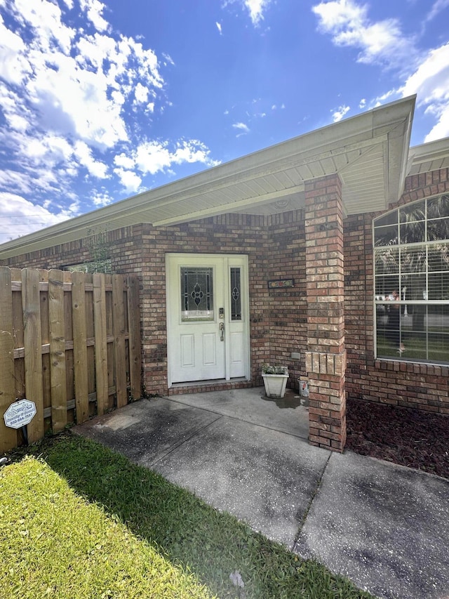 1174 Witshire Ct, Fort Walton Beach, FL 32547 - view of exterior entry featuring brick siding