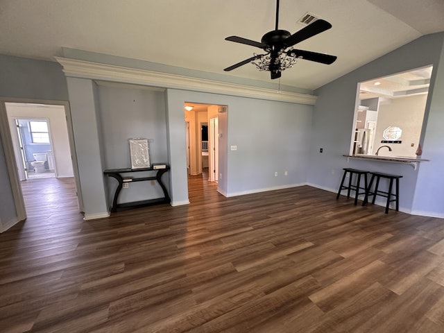 1174 Witshire Ct, Fort Walton Beach, FL 32547 - unfurnished living room featuring ceiling fan, vaulted ceiling, and dark wood-type flooring