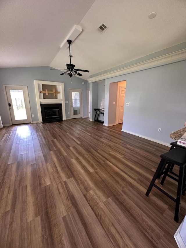 1174 Witshire Ct, Fort Walton Beach, FL 32547 - unfurnished living room with vaulted ceiling, ceiling fan, dark wood finished floors, and a fireplace