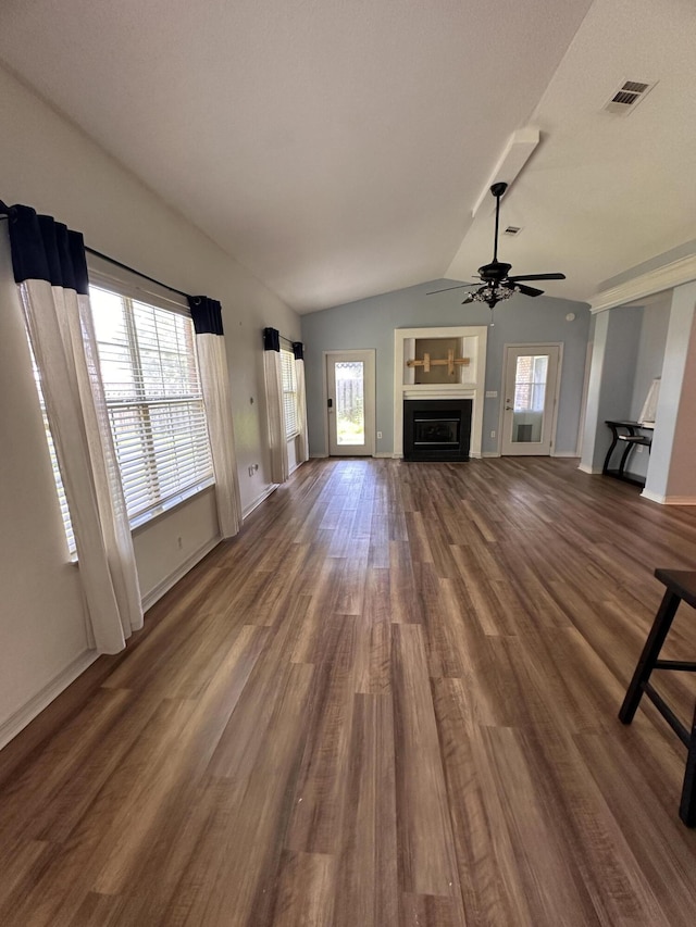 1174 Witshire Ct, Fort Walton Beach, FL 32547 - unfurnished living room featuring vaulted ceiling, dark wood-style floors, plenty of natural light, ceiling fan, and a fireplace