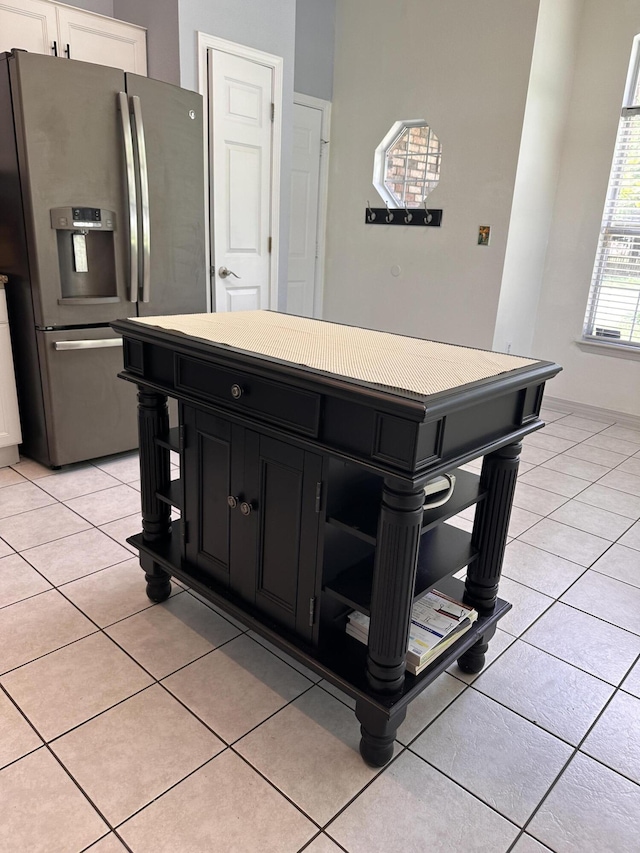 1174 Witshire Ct, Fort Walton Beach, FL 32547 - kitchen with stainless steel fridge, open shelves, dark cabinetry, and light tile patterned floors