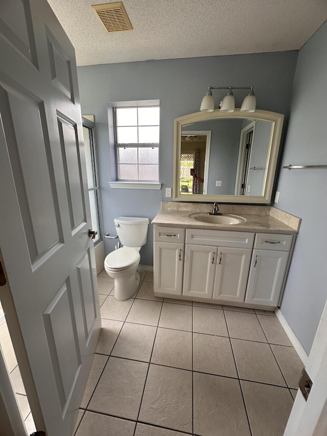 1174 Witshire Ct, Fort Walton Beach, FL 32547 - bathroom featuring vanity, tile patterned flooring, and a textured ceiling