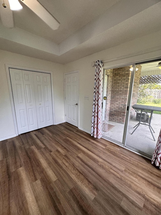 1174 Witshire Ct, Fort Walton Beach, FL 32547 - unfurnished bedroom with access to outside, dark wood-style floors, a closet, and ceiling fan