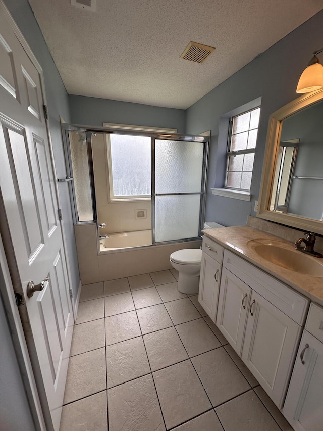 1174 Witshire Ct, Fort Walton Beach, FL 32547 - full bath with vanity, tile patterned floors, enclosed tub / shower combo, and a textured ceiling