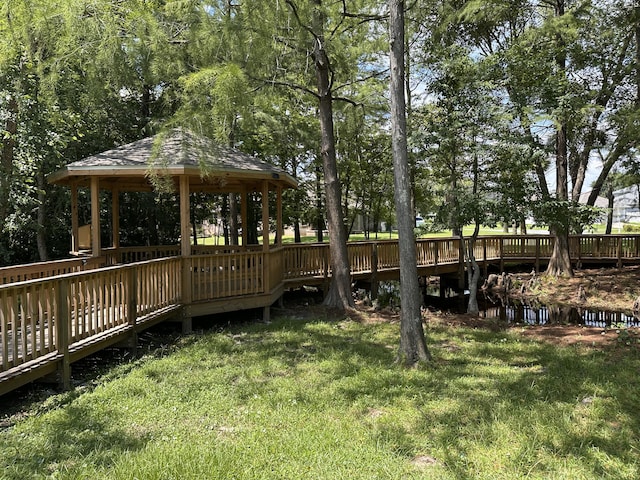 1174 Witshire Ct, Fort Walton Beach, FL 32547 - view of green lawn featuring a gazebo and a wooden deck