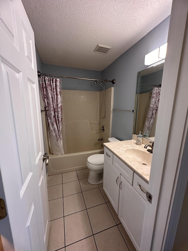 1174 Witshire Ct, Fort Walton Beach, FL 32547 - bathroom with a textured ceiling, vanity, tile patterned floors, and shower / bath combo with shower curtain