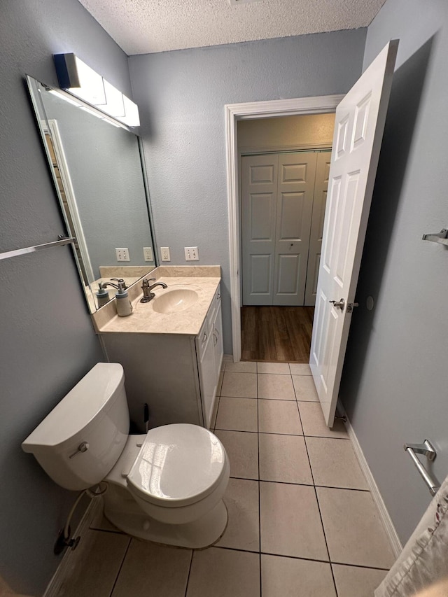 1174 Witshire Ct, Fort Walton Beach, FL 32547 - bathroom featuring tile patterned floors, a textured ceiling, and vanity
