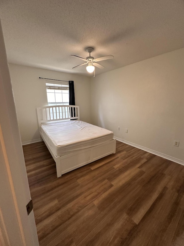 1174 Witshire Ct, Fort Walton Beach, FL 32547 - bedroom featuring dark wood finished floors, a textured ceiling, and ceiling fan
