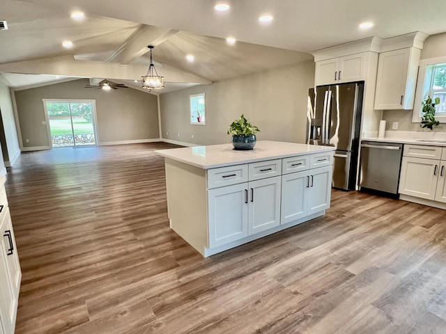 16 N 1st St, Defuniak Springs, FL 32433 - kitchen with appliances with stainless steel finishes, a center island, white cabinets, light countertops, and recessed lighting