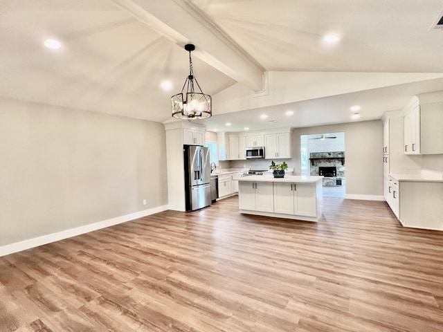16 N 1st St, Defuniak Springs, FL 32433 - kitchen featuring appliances with stainless steel finishes, open floor plan, light countertops, a chandelier, and recessed lighting