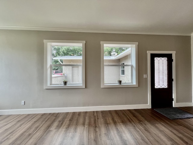 16 N 1st St, Defuniak Springs, FL 32433 - entrance foyer featuring wood finished floors and crown molding