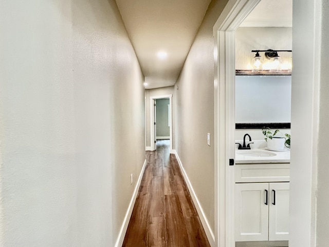 16 N 1st St, Defuniak Springs, FL 32433 - hall featuring a sink and wood finished floors