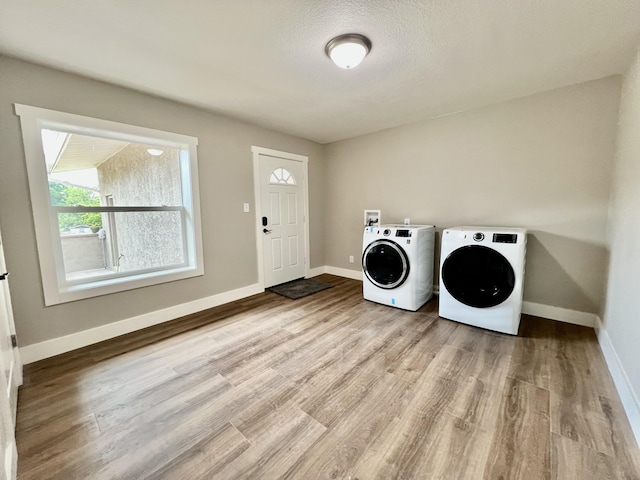 16 N 1st St, Defuniak Springs, FL 32433 - washroom featuring washer and clothes dryer and wood finished floors