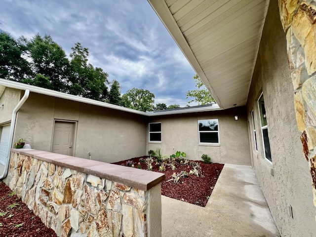 16 N 1st St, Defuniak Springs, FL 32433 - entrance to property featuring stucco siding