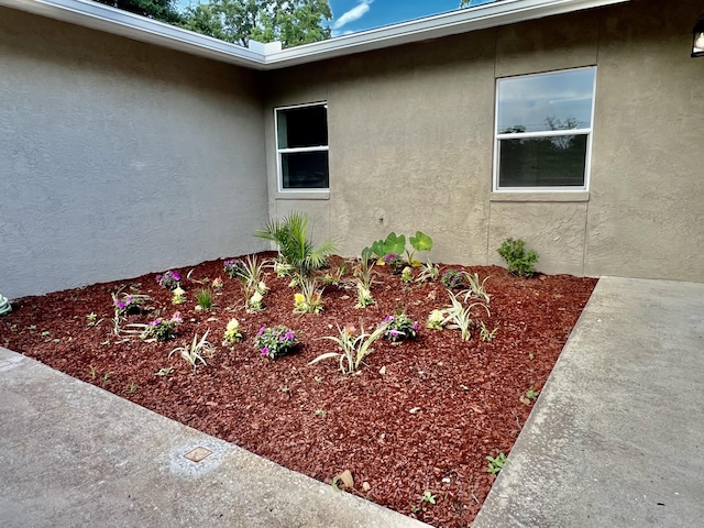 16 N 1st St, Defuniak Springs, FL 32433 - view of side of property featuring stucco siding