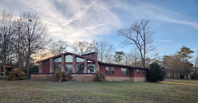5131 Wiggins Lake Rd, Walnut Hill, FL 32568 - view of property exterior with a lawn and a chimney