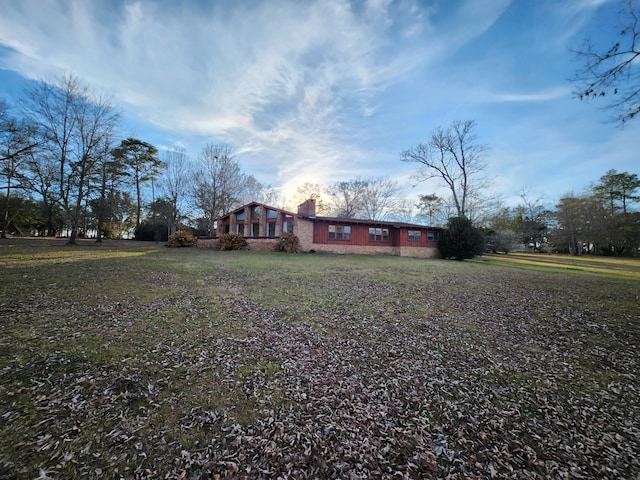 5131 Wiggins Lake Rd, Walnut Hill, FL 32568 - view of front of house featuring a chimney and a front lawn