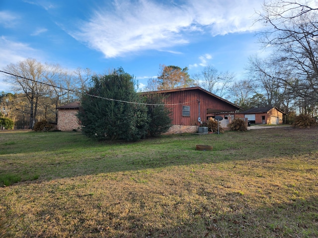5131 Wiggins Lake Rd, Walnut Hill, FL 32568 - view of home's exterior featuring a lawn and a cooling unit
