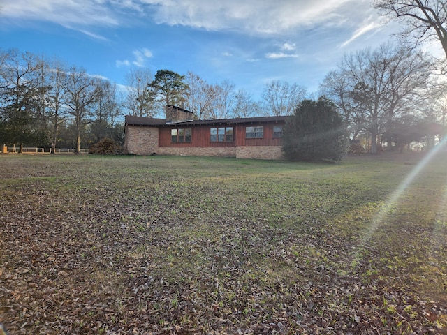 5131 Wiggins Lake Rd, Walnut Hill, FL 32568 - view of front of home featuring a chimney and a front yard