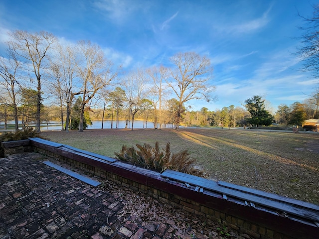 5131 Wiggins Lake Rd, Walnut Hill, FL 32568 - view of green lawn featuring a water view and view of wooded area
