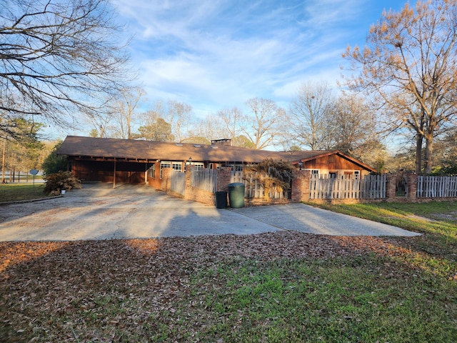 5131 Wiggins Lake Rd, Walnut Hill, FL 32568 - garage with a carport and concrete driveway