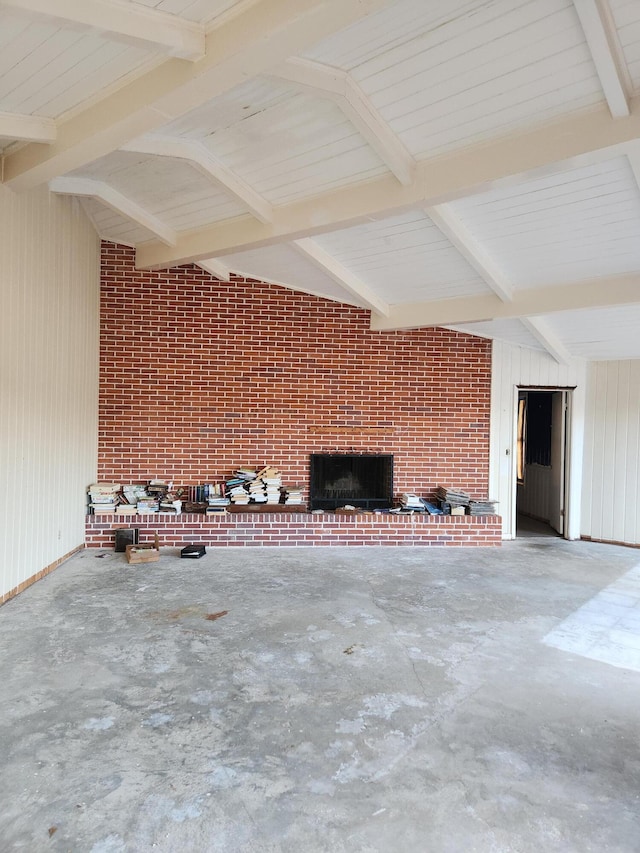 5131 Wiggins Lake Rd, Walnut Hill, FL 32568 - unfurnished living room with unfinished concrete floors, a fireplace, and beamed ceiling