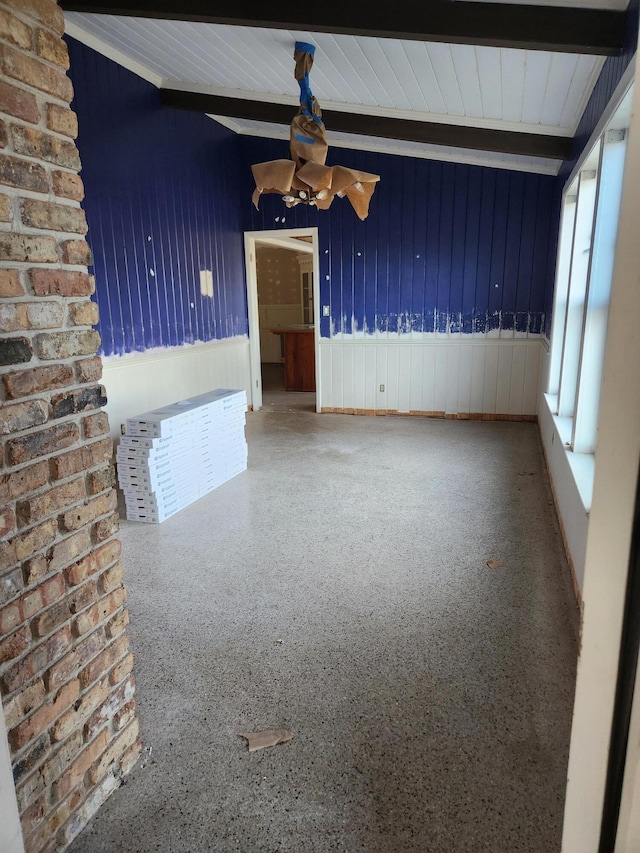 5131 Wiggins Lake Rd, Walnut Hill, FL 32568 - spare room featuring beam ceiling and a ceiling fan
