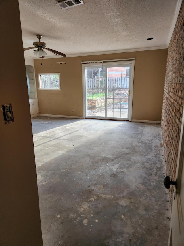 5131 Wiggins Lake Rd, Walnut Hill, FL 32568 - empty room with a textured ceiling, unfinished concrete flooring, ornamental molding, and a ceiling fan