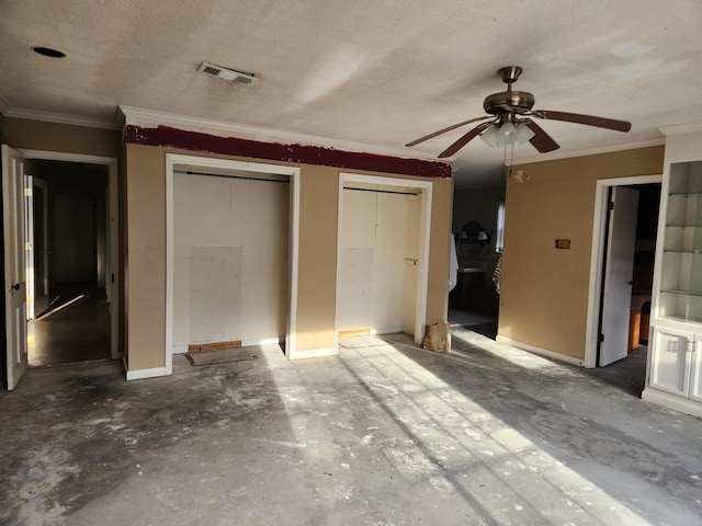 5131 Wiggins Lake Rd, Walnut Hill, FL 32568 - unfurnished bedroom featuring crown molding, two closets, unfinished concrete flooring, a textured ceiling, and a ceiling fan