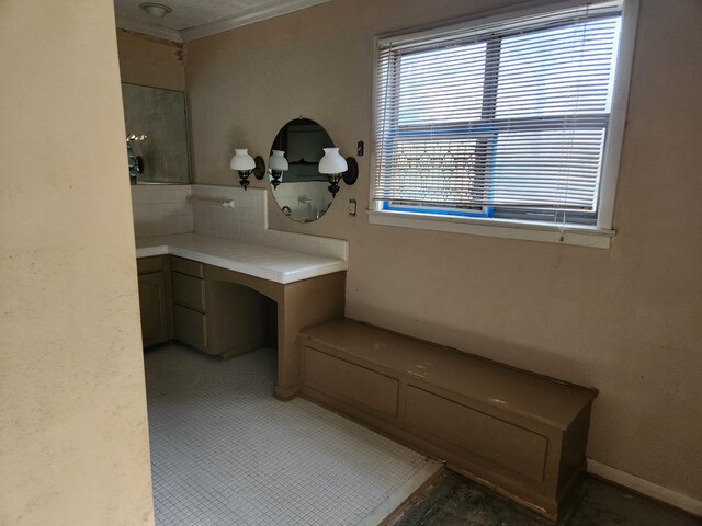 5131 Wiggins Lake Rd, Walnut Hill, FL 32568 - bathroom with ornamental molding and decorative backsplash
