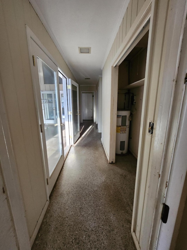 5131 Wiggins Lake Rd, Walnut Hill, FL 32568 - corridor with electric water heater and speckle patterned floor