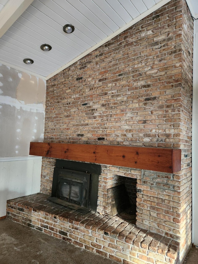 5131 Wiggins Lake Rd, Walnut Hill, FL 32568 - detailed view of carpet flooring, a brick fireplace, and a wainscoted wall