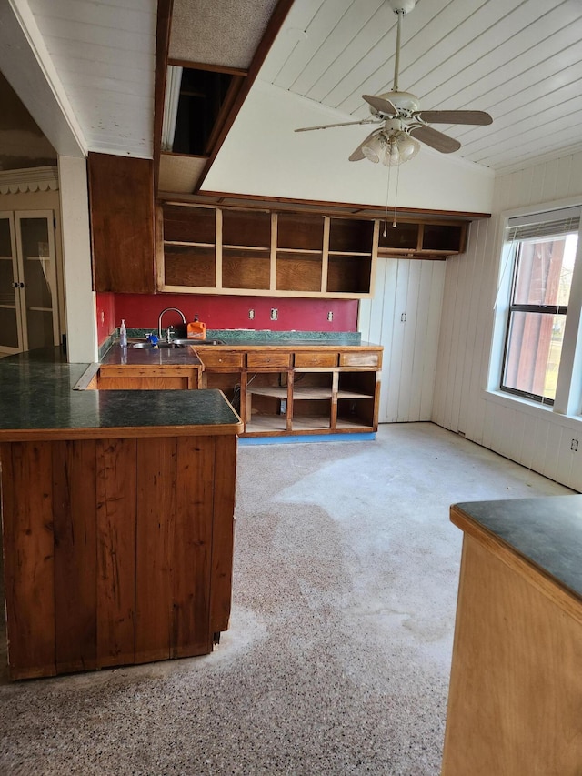 5131 Wiggins Lake Rd, Walnut Hill, FL 32568 - kitchen featuring a ceiling fan, dark countertops, wooden walls, wood ceiling, and open shelves