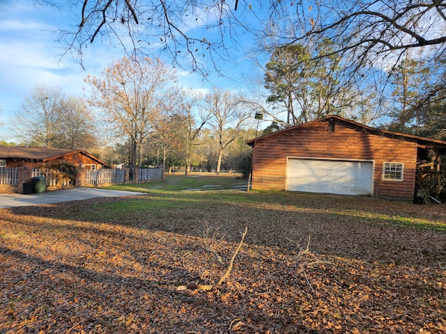 5131 Wiggins Lake Rd, Walnut Hill, FL 32568 - view of property exterior featuring an outdoor structure and a detached garage