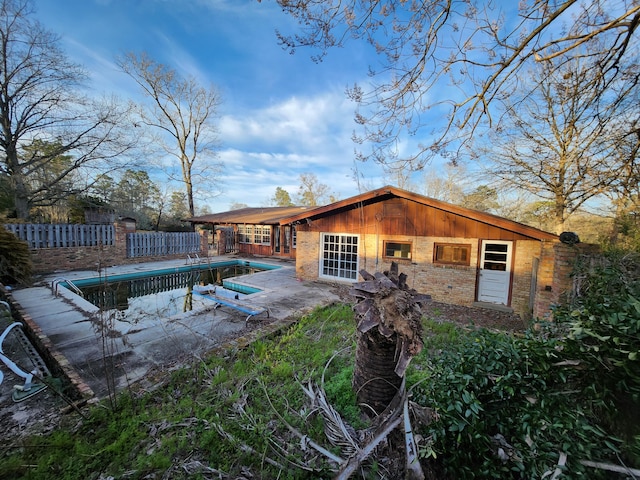 5131 Wiggins Lake Rd, Walnut Hill, FL 32568 - rear view of house with brick siding and a patio area
