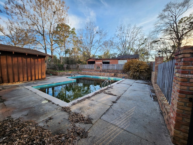 5131 Wiggins Lake Rd, Walnut Hill, FL 32568 - view of swimming pool with an outbuilding and a patio area