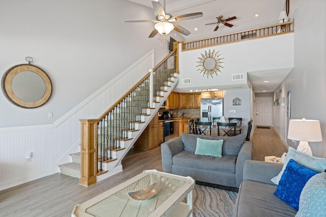 3290 Scenic Highway 98 Unit 305B, Destin, FL 32541 - living room with stairs, light wood finished floors, ceiling fan, a high ceiling, and recessed lighting