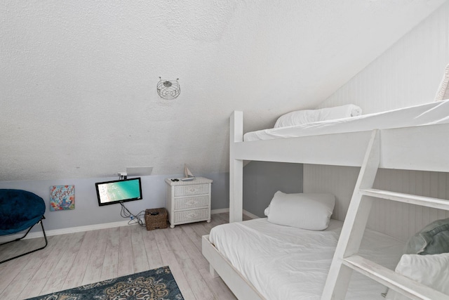 3290 Scenic Highway 98 Unit 305B, Destin, FL 32541 - bedroom with vaulted ceiling and wood finished floors