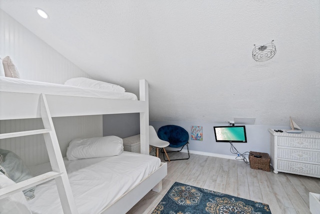 3290 Scenic Highway 98 Unit 305B, Destin, FL 32541 - bedroom with vaulted ceiling and wood finished floors