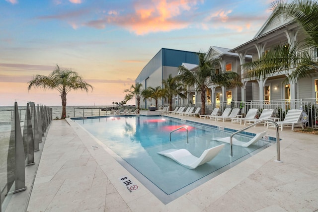 246 Dockside Dr, Port St Joe, FL 32456 - pool at dusk with a community pool and a patio