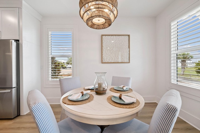 246 Dockside Dr, Port St Joe, FL 32456 - dining space with plenty of natural light and light wood-style floors