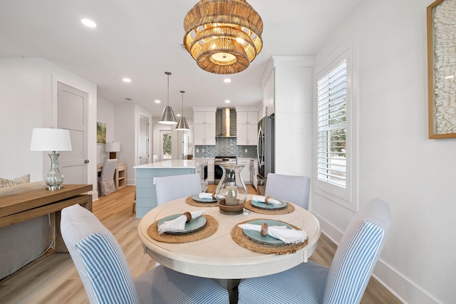 246 Dockside Dr, Port St Joe, FL 32456 - dining space featuring light wood-type flooring and recessed lighting