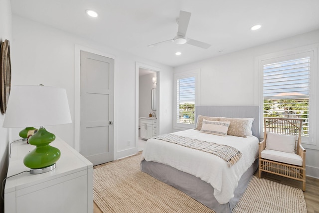 246 Dockside Dr, Port St Joe, FL 32456 - bedroom featuring light wood-type flooring, recessed lighting, ensuite bath, and ceiling fan