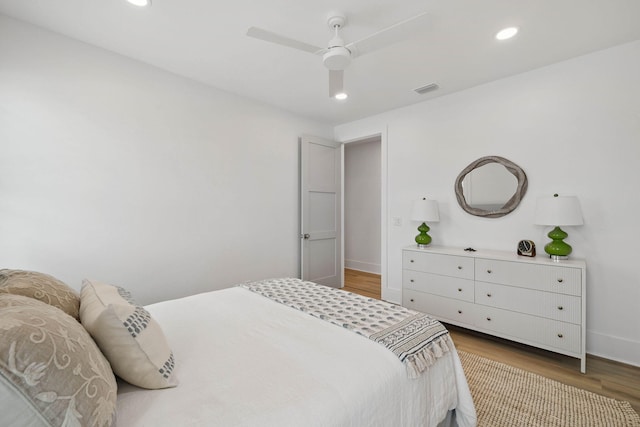 246 Dockside Dr, Port St Joe, FL 32456 - bedroom with wood finished floors, recessed lighting, and ceiling fan