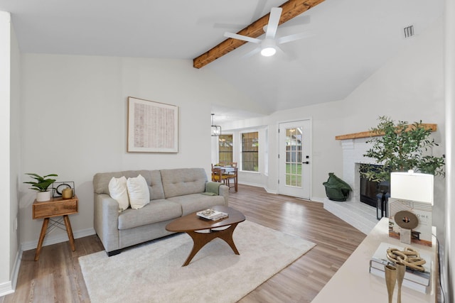 136 Oak Terrace Dr, Crestview, FL 32539 - living area with ceiling fan, wood finished floors, and a fireplace