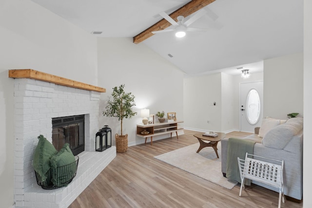 136 Oak Terrace Dr, Crestview, FL 32539 - living room with ceiling fan, a brick fireplace, and light wood-style floors