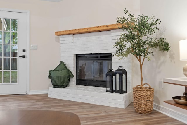 136 Oak Terrace Dr, Crestview, FL 32539 - detailed view of wood finished floors and a brick fireplace