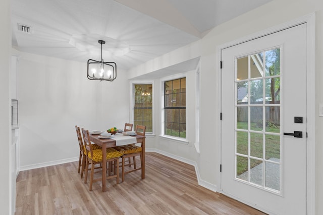 136 Oak Terrace Dr, Crestview, FL 32539 - dining area with a chandelier and light wood finished floors