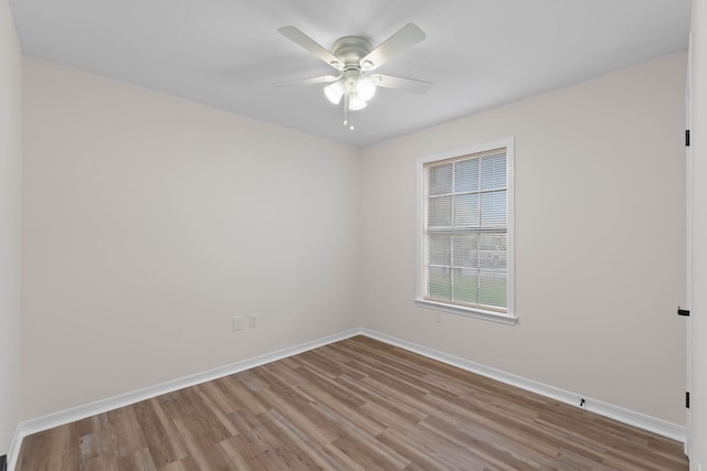 136 Oak Terrace Dr, Crestview, FL 32539 - empty room with wood finished floors and ceiling fan